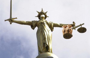 scales-of-justice-gagged-graphic-980101752